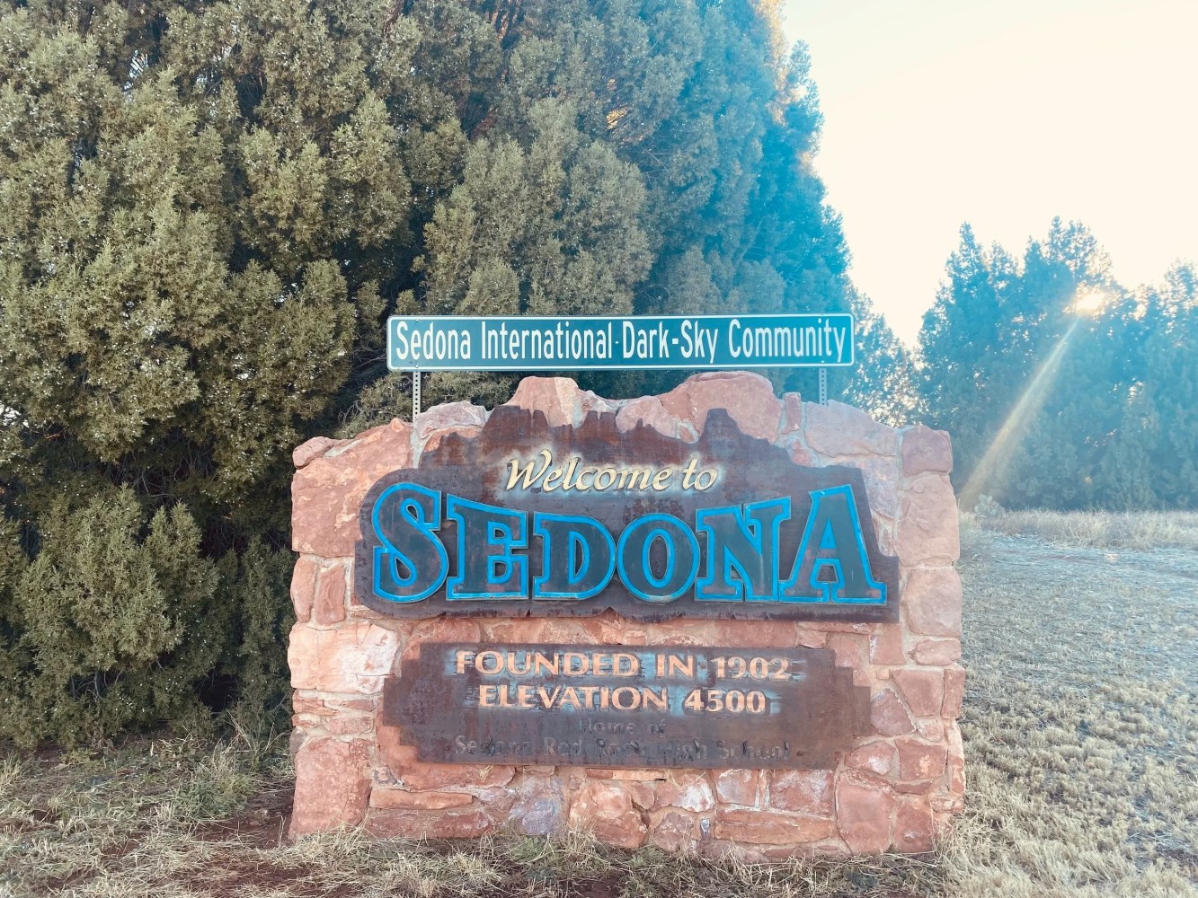 Welcome sign for Sedona with elevation and dark-sky community notice.